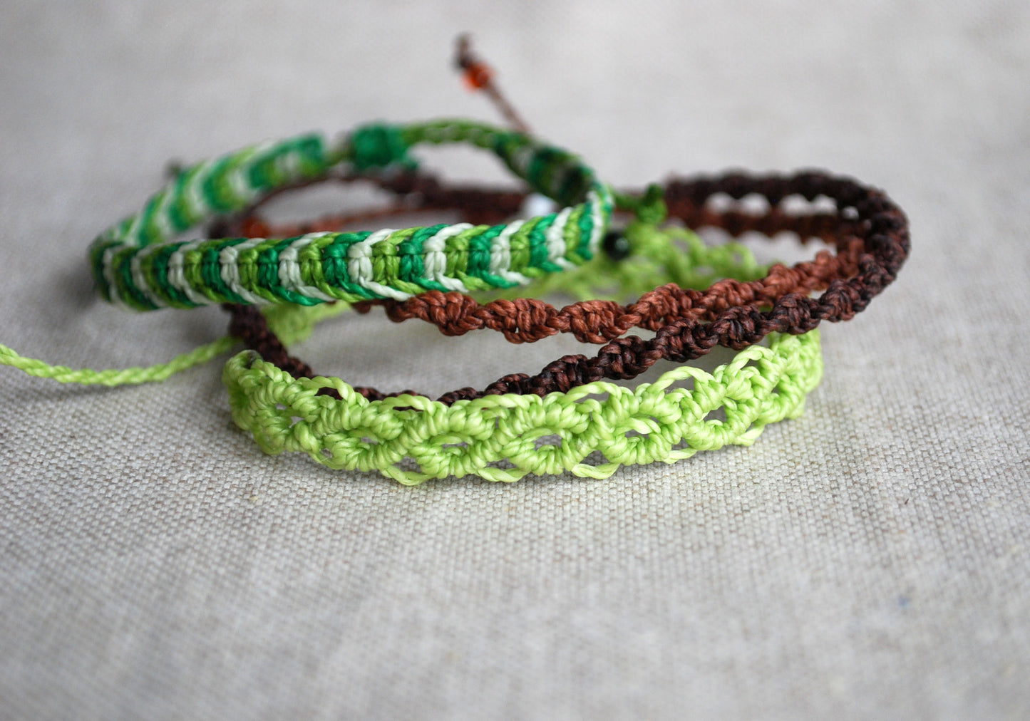 Set of four green and brown macrame bracelets