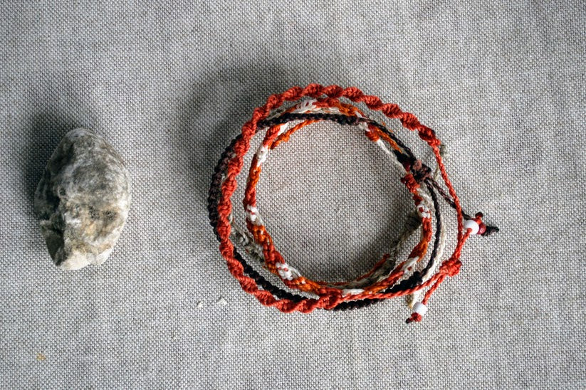 Set of four ocher and gray macramé bracelets