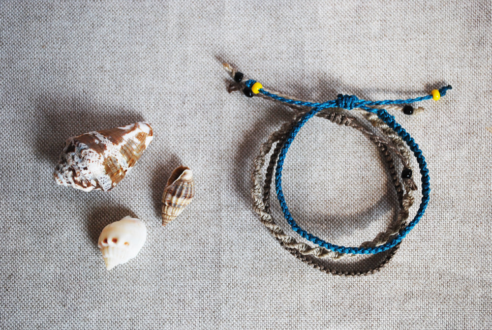 Set of three gray and teal bracelets