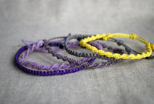 set cinque bracciali sfumature di viola e giallo limone